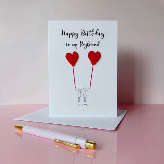 Greeting card with red heart balloons and 'Happy Birthday to my Boyfriend' text. 