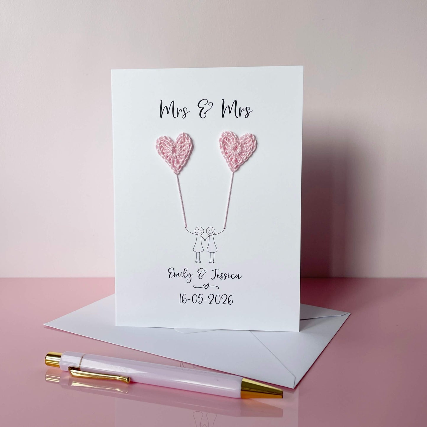 Greeting card with pink crochet heart balloons and text on a pink background