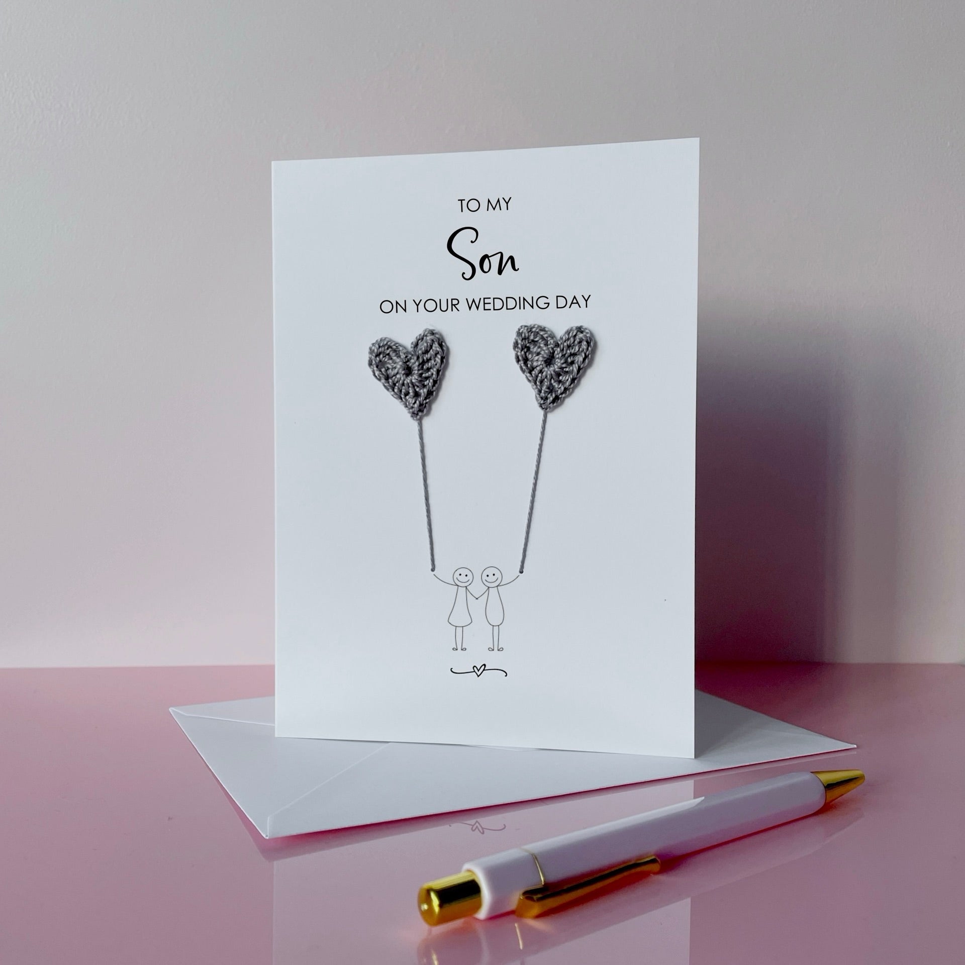 Greeting card for a son on their wedding day with grey crochet heart balloons. 