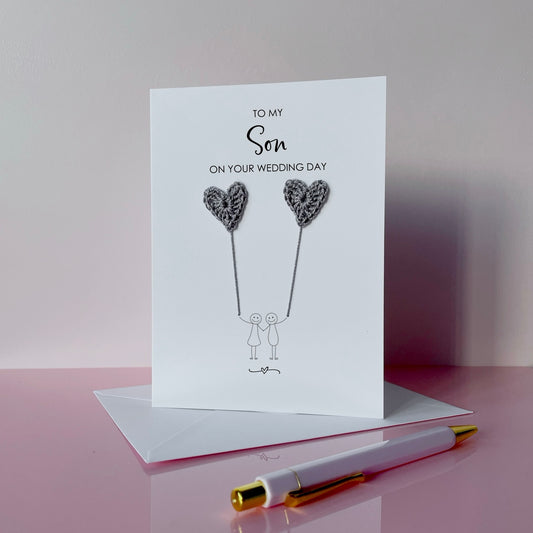 Greeting card for a son on their wedding day with grey crochet heart balloons. 